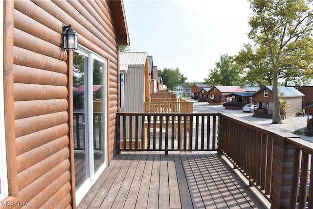 wooden deck featuring a residential view