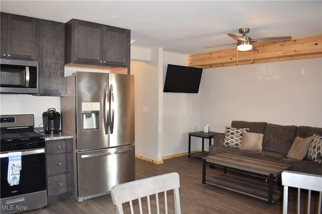 kitchen with dark hardwood / wood-style flooring, ceiling fan, dark brown cabinets, and stainless steel appliances