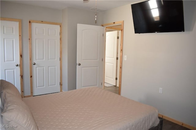 bedroom featuring baseboards