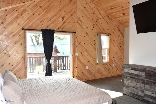 bedroom with access to exterior, wood ceiling, hardwood / wood-style flooring, high vaulted ceiling, and wood walls