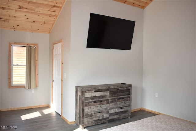 interior space featuring vaulted ceiling, dark wood-type flooring, and wood ceiling