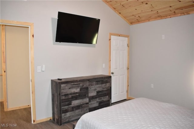 bedroom featuring hardwood / wood-style floors, lofted ceiling, and wood ceiling