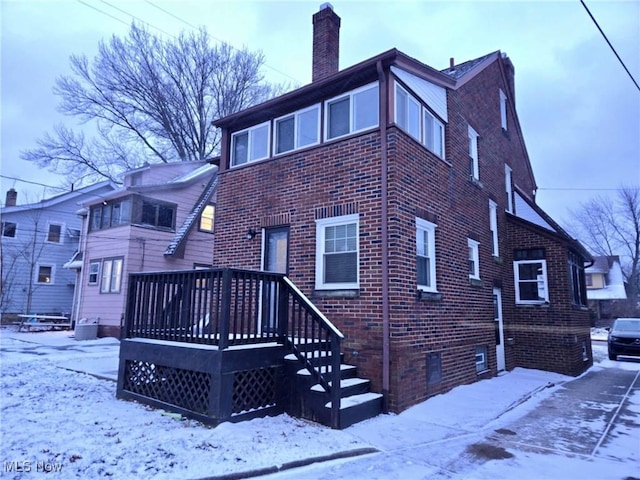 view of snow covered house