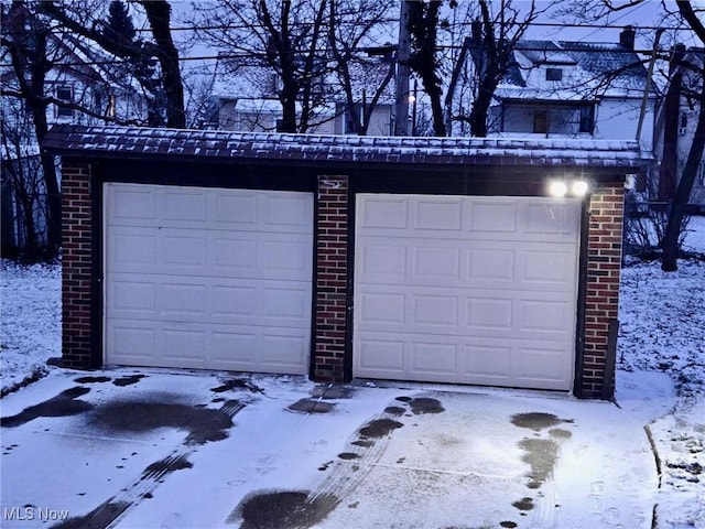 view of snow covered garage