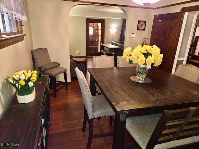 dining area with dark wood-type flooring