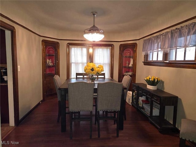 dining area with dark hardwood / wood-style floors