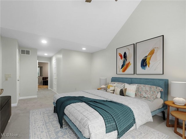 carpeted bedroom with lofted ceiling