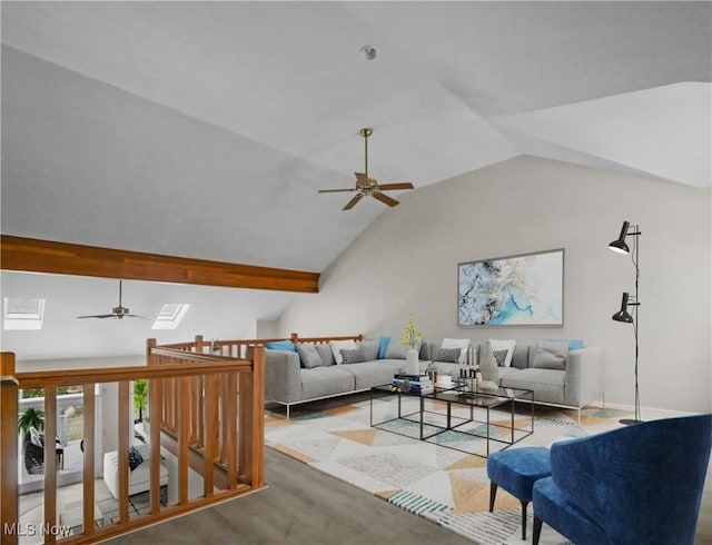 living room featuring vaulted ceiling with skylight, ceiling fan, and hardwood / wood-style floors