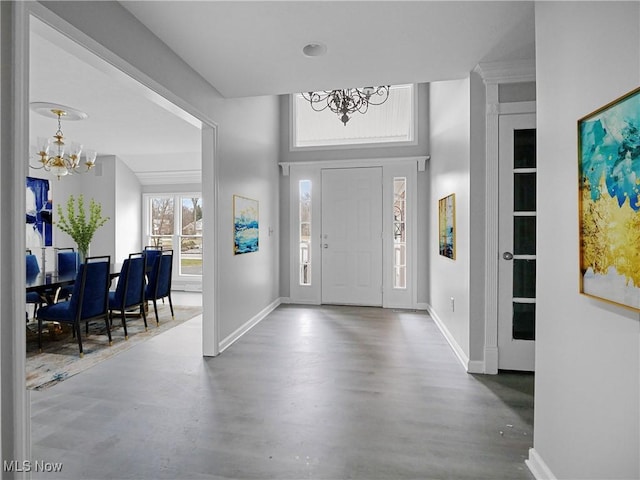 entrance foyer with a notable chandelier