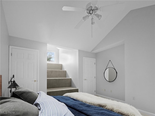 bedroom featuring ceiling fan and lofted ceiling