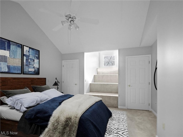 bedroom featuring ceiling fan, carpet floors, and vaulted ceiling