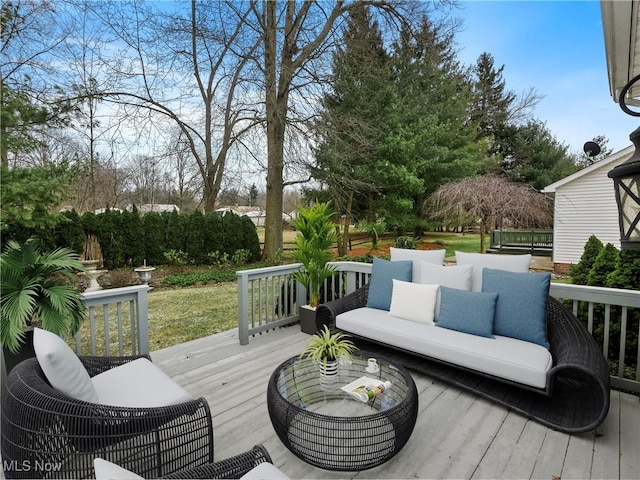 wooden terrace featuring an outdoor hangout area