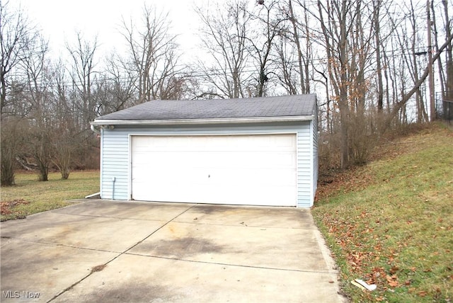 garage with a lawn