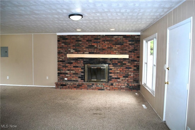 unfurnished living room featuring carpet flooring, a fireplace, and a textured ceiling