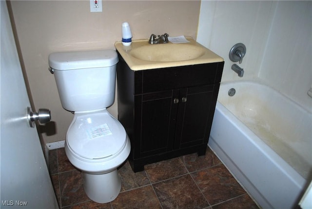 full bathroom with washtub / shower combination, vanity, and toilet