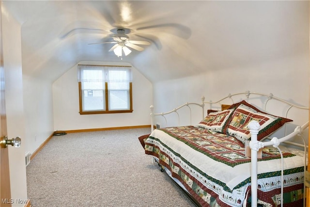 carpeted bedroom featuring ceiling fan and vaulted ceiling