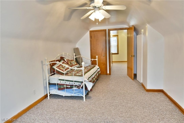 bedroom featuring ceiling fan, carpet floors, and vaulted ceiling