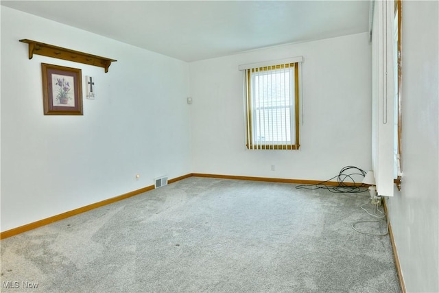 spare room featuring carpet