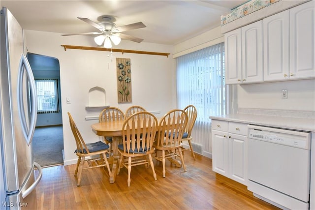 dining room with ceiling fan and light hardwood / wood-style floors