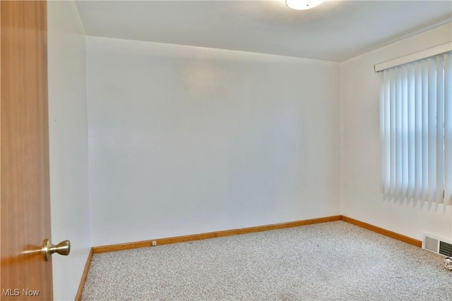 unfurnished room with carpet