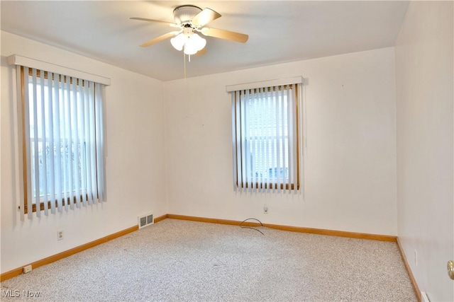 carpeted empty room with ceiling fan