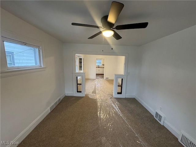 unfurnished room featuring ceiling fan