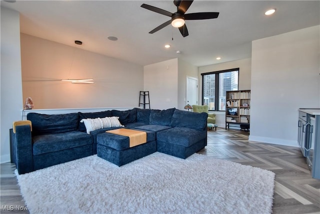 living area with recessed lighting, baseboards, and ceiling fan