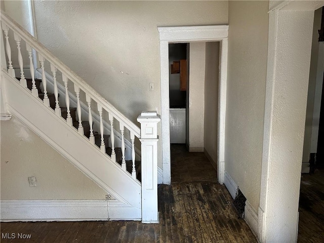 stairs with hardwood / wood-style flooring