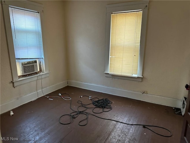 unfurnished room with cooling unit