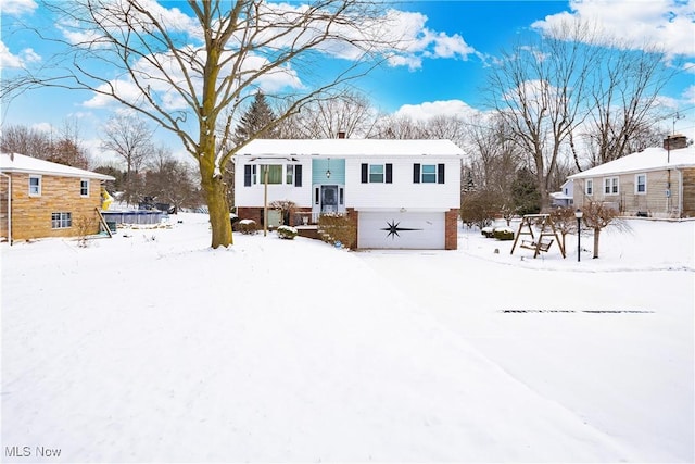 view of front of home with a garage