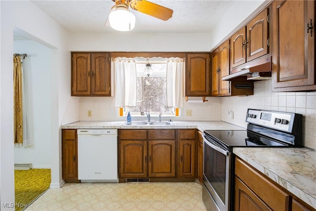 kitchen featuring ceiling fan, sink, tasteful backsplash, white dishwasher, and stainless steel electric stove