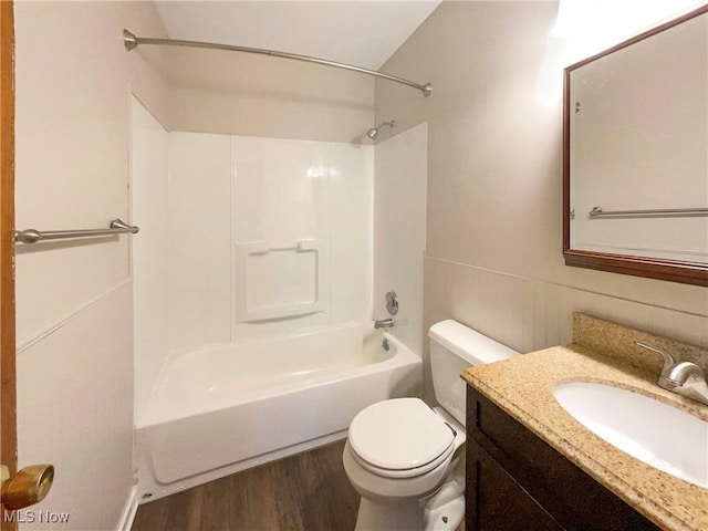 full bathroom featuring wood-type flooring, vanity, toilet, and shower / bathtub combination