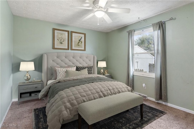 bedroom with carpet flooring, a textured ceiling, and ceiling fan