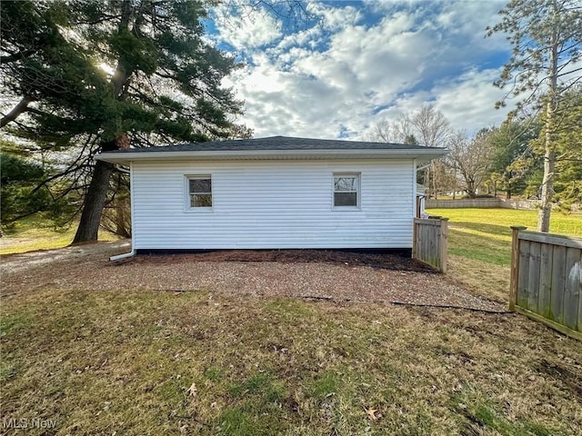 view of outbuilding featuring a yard