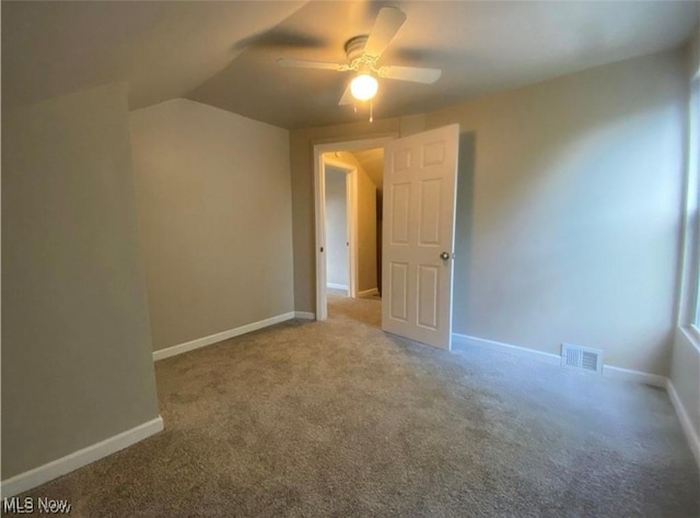 interior space featuring ceiling fan and lofted ceiling