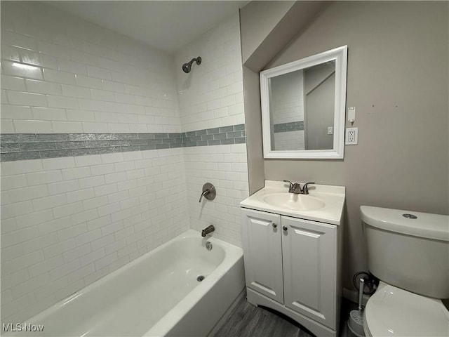 747 Brownell Ave, Lorain, OH 44052 - full bath featuring toilet, vanity, shower / bath combination, and wood finished floors