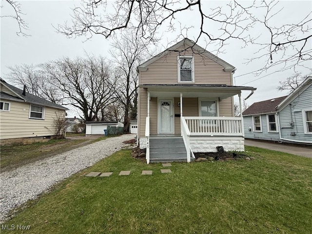 747 Brownell Ave, Lorain, OH 44052 - view of front facade with a front yard and covered porch