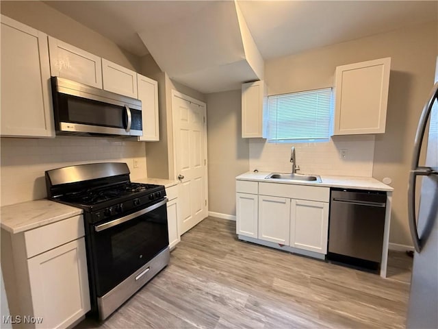 747 Brownell Ave, Lorain, OH 44052 - kitchen with a sink, light countertops, and appliances with stainless steel finishes