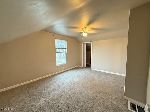 747 Brownell Ave, Lorain, OH 44052 - additional living space with visible vents, baseboards, ceiling fan, lofted ceiling, and carpet floors