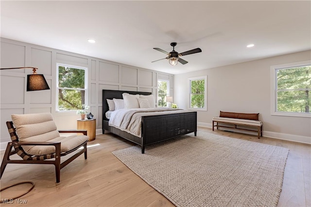 bedroom featuring ceiling fan and light hardwood / wood-style floors