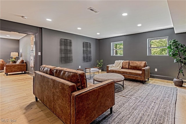 living room with light hardwood / wood-style flooring