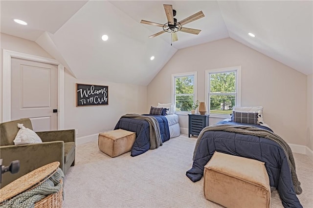 bedroom featuring ceiling fan, light colored carpet, and lofted ceiling