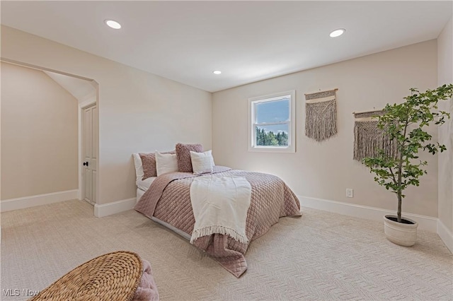 bedroom with light colored carpet