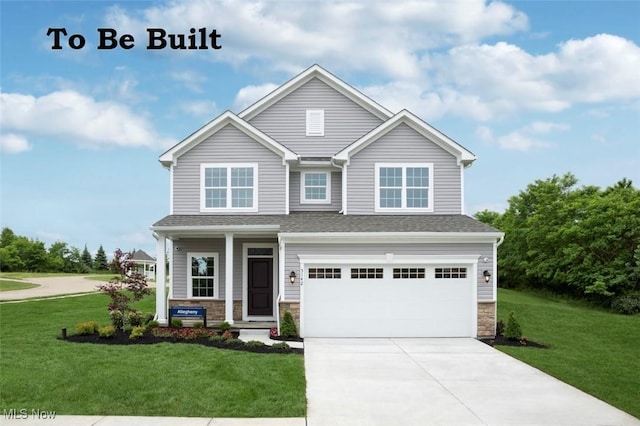 craftsman-style house with a front yard and a garage