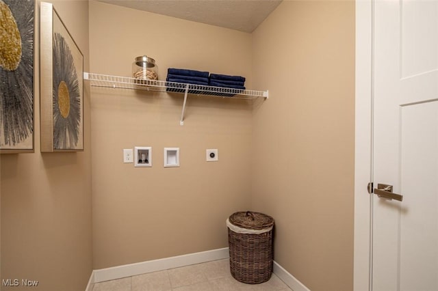 laundry room featuring hookup for an electric dryer, a textured ceiling, and hookup for a washing machine