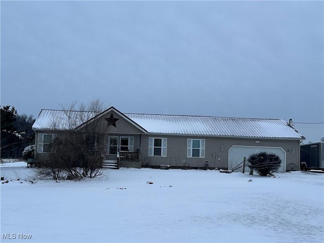 view of front of property featuring a garage