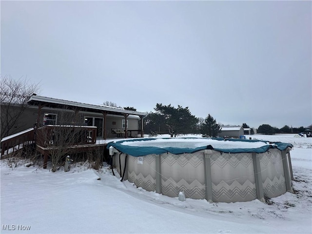 view of snow covered pool