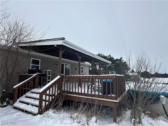 view of snow covered deck