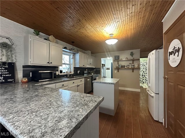 kitchen featuring a center island, white cabinets, sink, dark hardwood / wood-style floors, and appliances with stainless steel finishes