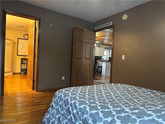 bedroom with light hardwood / wood-style floors